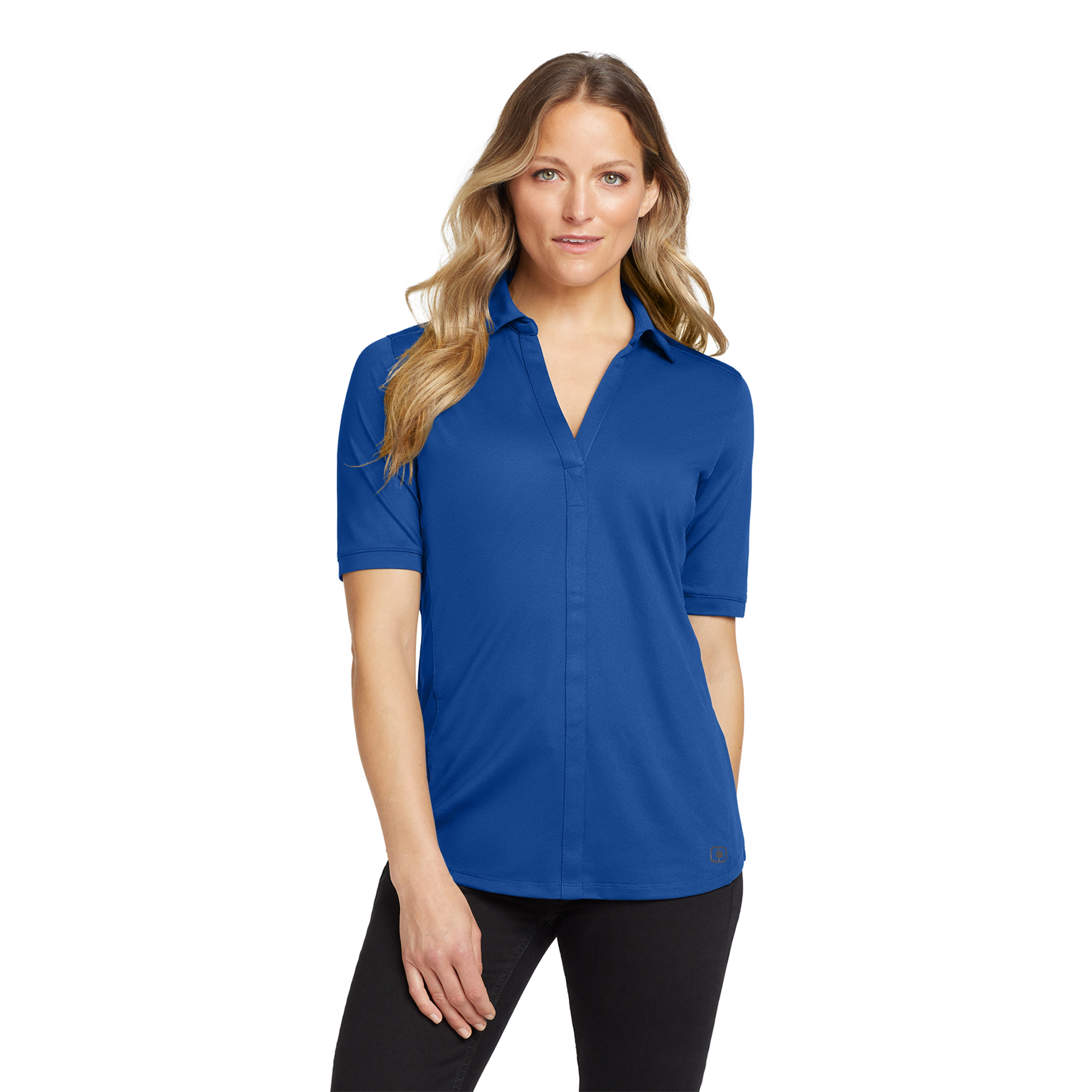 Woman wearing a royal blue polo shirt, facing the camera against a white background.