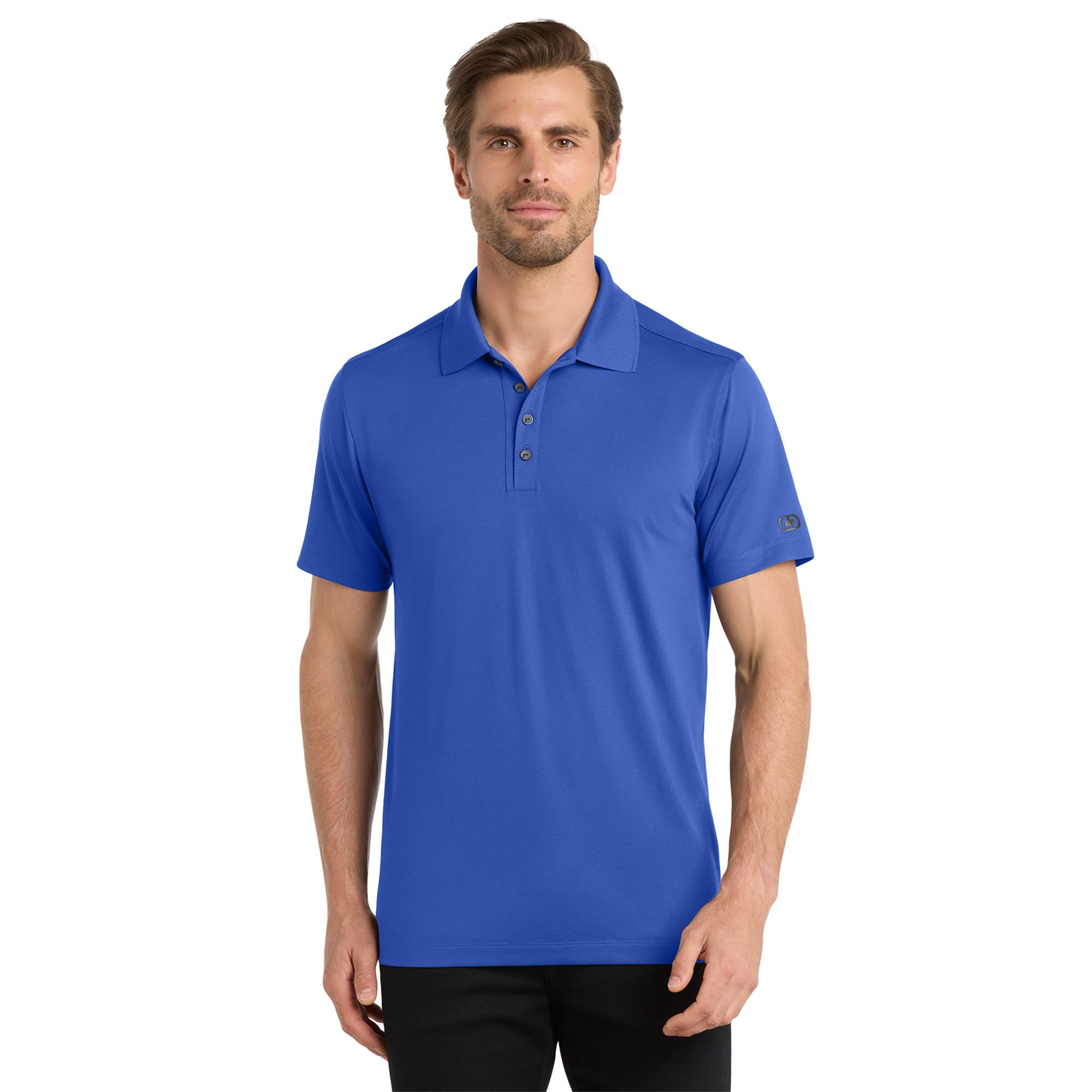 Man in a blue polo shirt, standing against a white background, facing the camera.