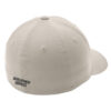 Beige baseball cap close-up, showing stitched panels and the text 'DEVELOPMENT SERVICES' on the back